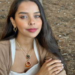 Woman with jewelry in a forest setting
