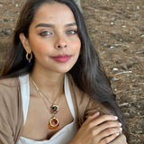 Woman with jewelry in a forest setting