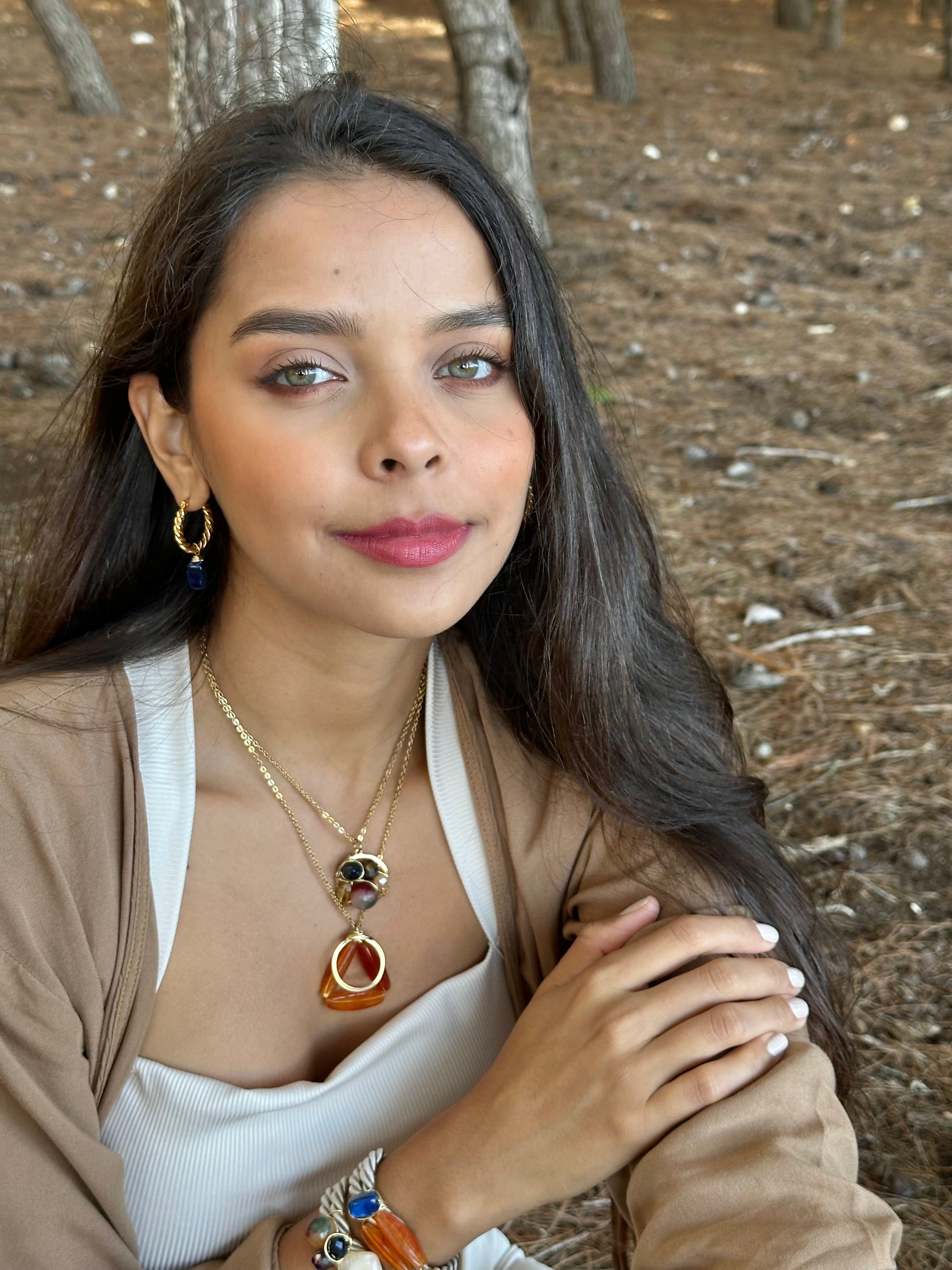 Woman with jewelry in a forest setting